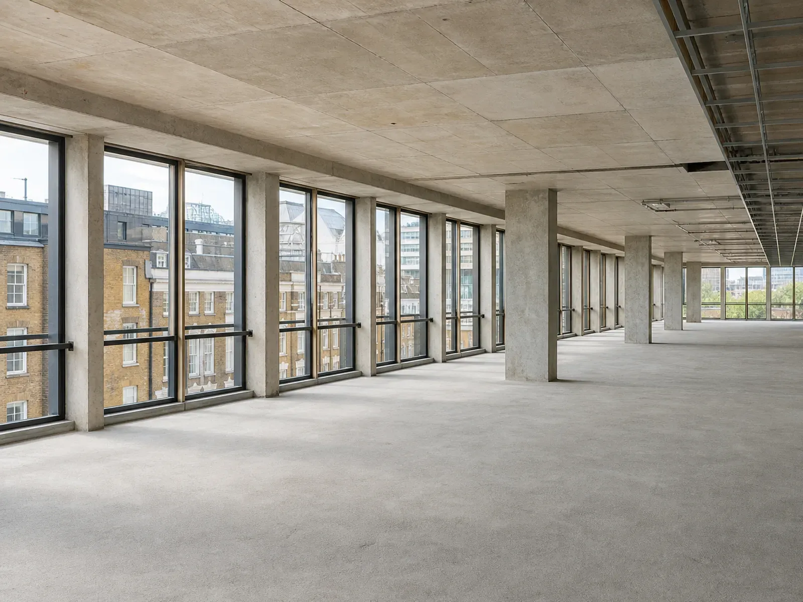 Open-plan office floor stripped back to its concrete shell